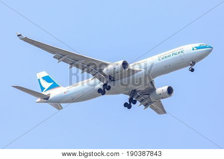Bangkok, Thailand. - April 22, 2017 : Plane of Cathy Pacific Airlines or Airways on the sky landing to Suvanabhumi airport.