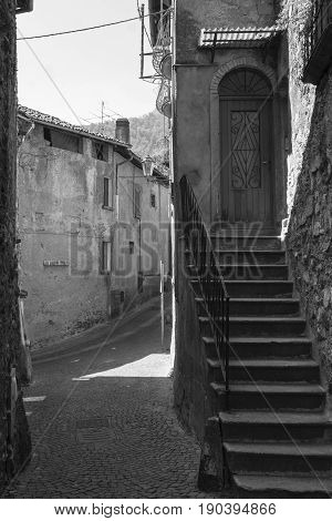Asso (Como Lombardy Italy): typical street in the historic town. Black and white