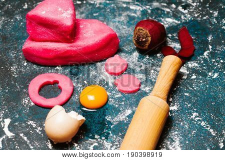 Pink doudh and food ingredients: egg beet flour. Top view flat lay