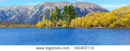 Panoramic image of beautiful Lake Pearson (Moana Rua) in Autumn Arthur's pass National Park South Island of New Zealand