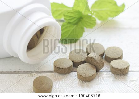 pill herbal on top view of wood table and copy space