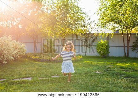 cute cauasian baby girl and big lollipop.