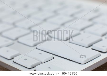 Background View Of A White Laptop Keyboard