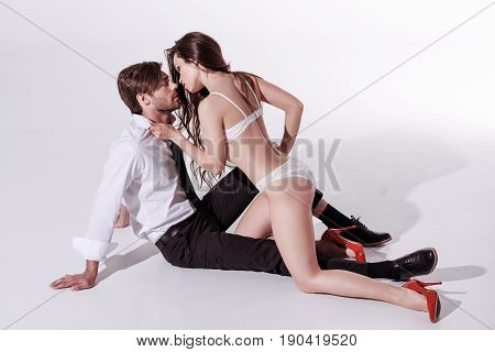 Passionate Sexy Woman In Underwear Seducing And Able To Kiss Elegant Man In Foreplay