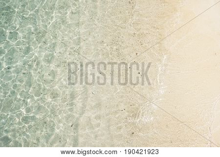 Beach tropical with white sandy and crystal water seen from above. Rawa island Malaysia .