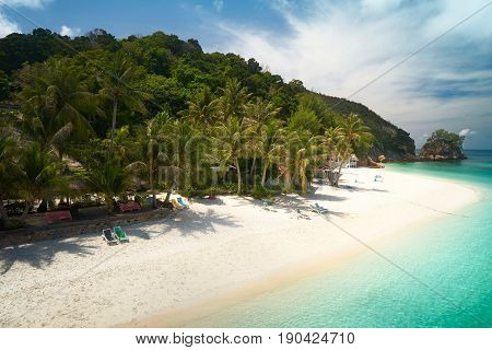 Beautiful beach aerial view over a Rawa island. White sandy beach seen from above. Malaysia .