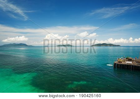Traveler have fun on the jetty of the port in the sunny day Rawa island Malaysia .