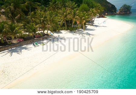 Beautiful beach aerial view over a Rawa island. White sandy beach seen from above. Malaysia .