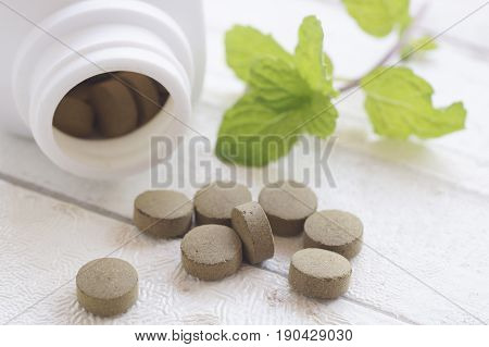 pill herbal on top view of wood table and copy space