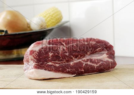 Beef on a wooden plate with a nice marbling
