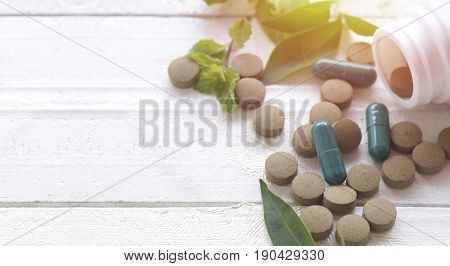 pill herbal on top view of wood table and copy space