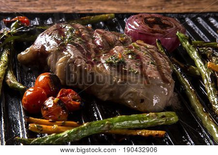 Ancho Steak With Grilled Vegetables On The Grill