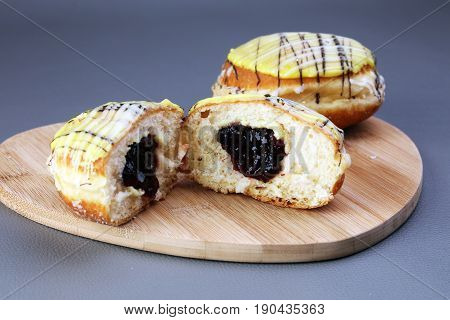 German Donuts - Berliner With Jam And Icing Sugar In A Tray On A Grey Background.