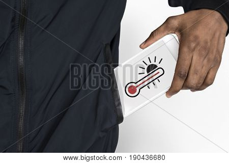 Hand holding digital device network graphic overlay from jacket pocket
