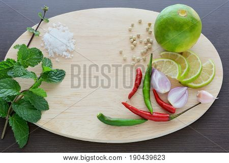 Asian cuisine ingredients food top view spice lemon onion garlic chili pepper mint salt for cooking original eastern foods style on top wood texture background Thailand food spices
