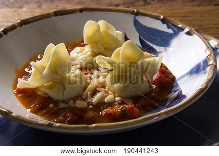 Fagottini pasta with tomato sauce. Gourmet food.
