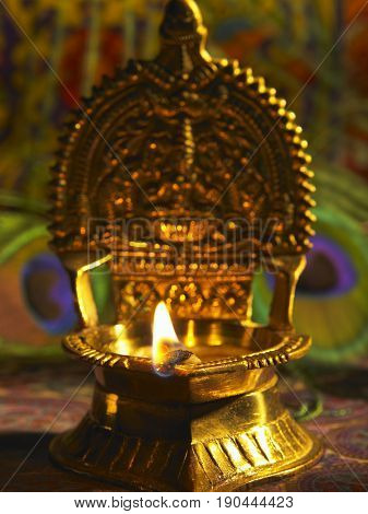 front view of lit indian oil lamp  