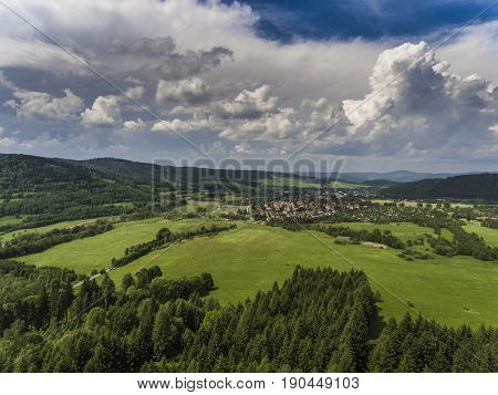 Aerial View Of The Summer Time In Mountains Near Stronie Slaskie Town In Poland. Pine Tree Forest An