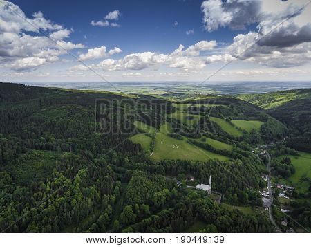 Aerial View Of The Summer Time In Mountains In Border Poland And Czech Republic. Pine Tree Forest An