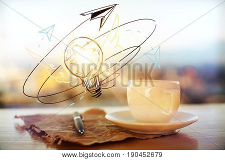Close up of coffee cup crumples paper sheet with pen and lamp sketch on blurry city background. Idea concept