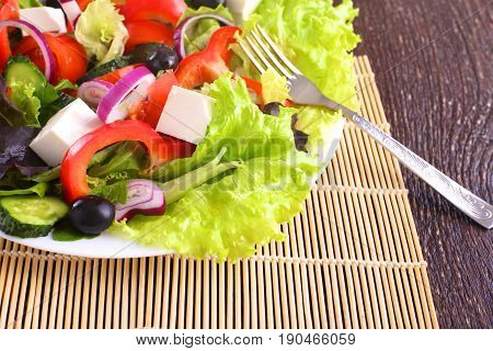 Fresh vegetables on wooden and blur background.