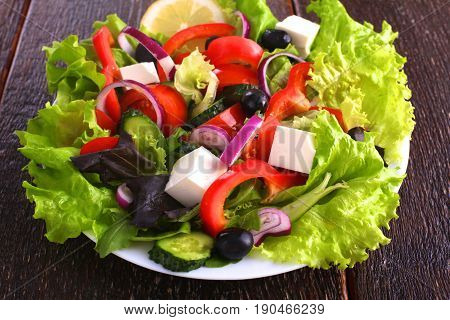 Fresh vegetables on wooden and blur background.