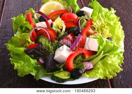 Fresh vegetables on wooden and blur background.
