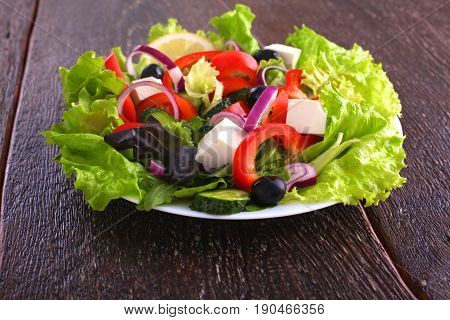 Fresh vegetables on wooden and blur background.