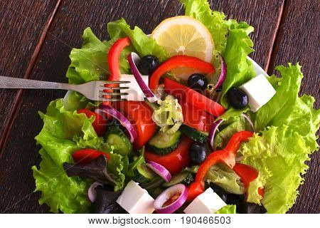 Fresh vegetables on wooden and blur background.