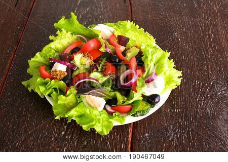 Fresh vegetables on wooden and blur background.