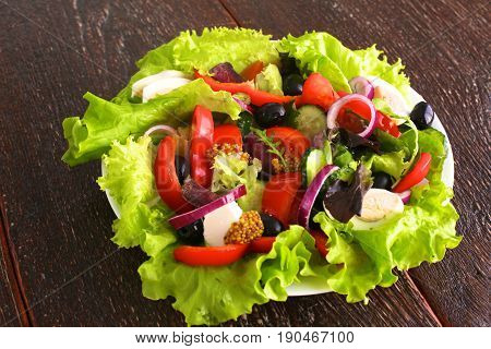 Fresh vegetables on wooden and blur background.