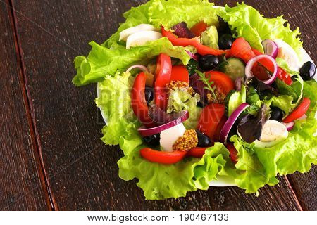 Fresh vegetables on wooden and blur background.