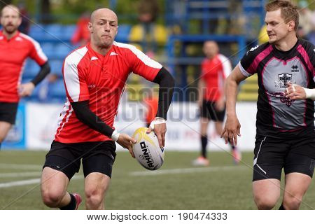 ST. PETERSBURG, RUSSIA - MAY 27, 2017: Match Busly, Belarus (red and white shirts) vs Livonia, Latvia during Rugby Europe Sevens Club Champion's Trophy.  