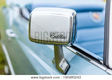 PAAREN IM GLIEN GERMANY - JUNE 03 2017: Rear view mirror of a full-size personal luxury car Cadillac Eldorado (Seventh generation). Exhibition 