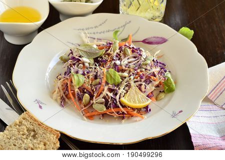 Salad with cabbage carrots and pumpkin sunflower sesame seeds, Cole Slaw