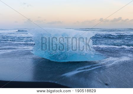 Ice cubed on black sand beach and skyline natural winter season landscape background