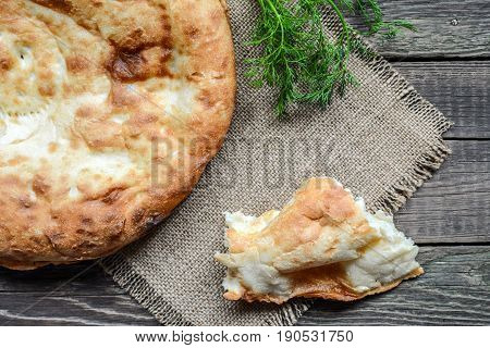 Pita flatbread,. traditional asian bread on wooden background