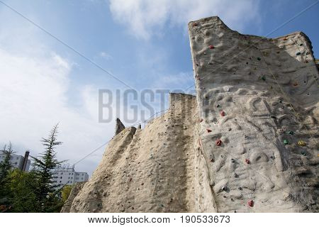 Outdoor artificial climbing wall in a public park
