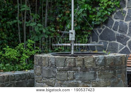 Typical German Circular Grill For Grilling Sausage Grillwurst  - Stainless Steel And Natural Stone