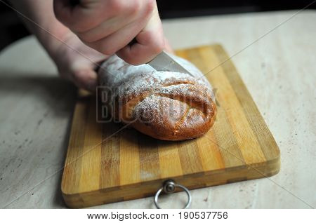 Man hands cutting pineapple pie close up