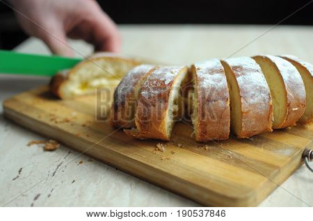 Man hands cutting pineapple pie close up