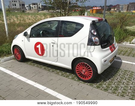Almere Poort, Flevoland, The Netherlands - June 10, 2017: White Citroen c1 sport parked on a public parking lot in the city of Almere. Nobody in the vehicle.