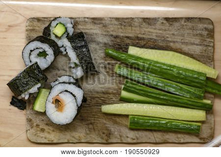 End Of Different Sushi Rolls And Chopped Cucumber