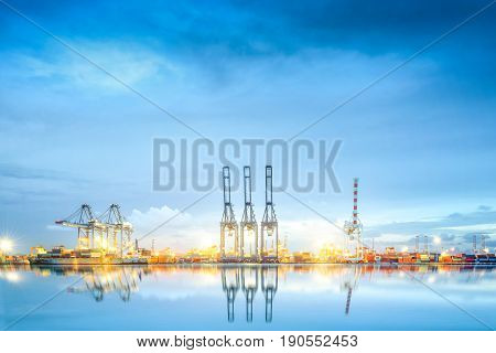 Logistics and transportation of International Container Cargo ship in a harbor with water reflections for logistic import export background and transport industry.