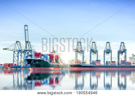 International Container Cargo ship with working crane bridge in shipyard background logistic import export background and transport industry.