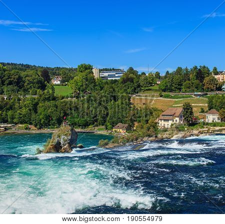Laufen, Switzerland - 29 August, 2015: the Rhine Falls. The Rhine Falls is the largest plain waterfall in Europe, located on the border between the Swiss cantons of Schaffhausen and Zurich in northern Switzerland.