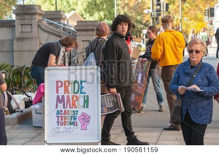 Adelaide, AU - June 10, 2017: South Australians gather at Parliament House and Rundle Mall to protest Trump's assumed support for laws discriminating against LGBTI people in the name of religious freedom.