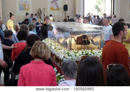 ZAGREB, CROATIA - APRIL 16: Worshippers gather to look at the relics of St. Leopold Mandic in the parish Church of Saint Leopold Mandic, Zagreb, Croatia on April 16, 2016.