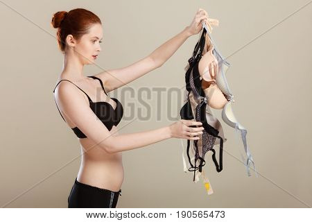 Woman Choosing Bras To Wear
