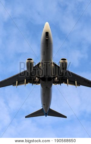 The underside of a modern airplane and its landing gear